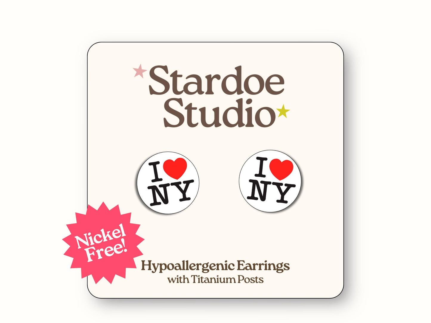 Small circular white earrings featuring the iconic I Love NY logo with red heart symbol replacing the word love, celebrating New York City's famous tourist slogan and Big Apple pride, showcasing classic NYC souvenir design that tourists and locals adore, secured with hypoallergenic titanium posts, perfect for kids who love travel themed jewelry and city culture accessories