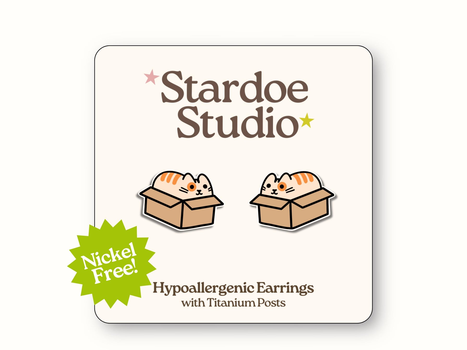 Small handmade orange cat in cardboard box earring studs with cute tabby face peeking out, secured with hypoallergenic titanium posts, perfect for kids who love playful cats and funny pet accessories. Made with hypoallergenic titanium posts.