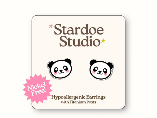 Small round panda face earrings with black ears and eye patches, white faces with cute expressions, secured with hypoallergenic titanium posts, perfect for kids
