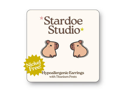 Little capybara stud earrings featuring an adorable capybara design. These earrings are handmade with hypoallergenic titanium posts animal jewelry for kids and adults.
