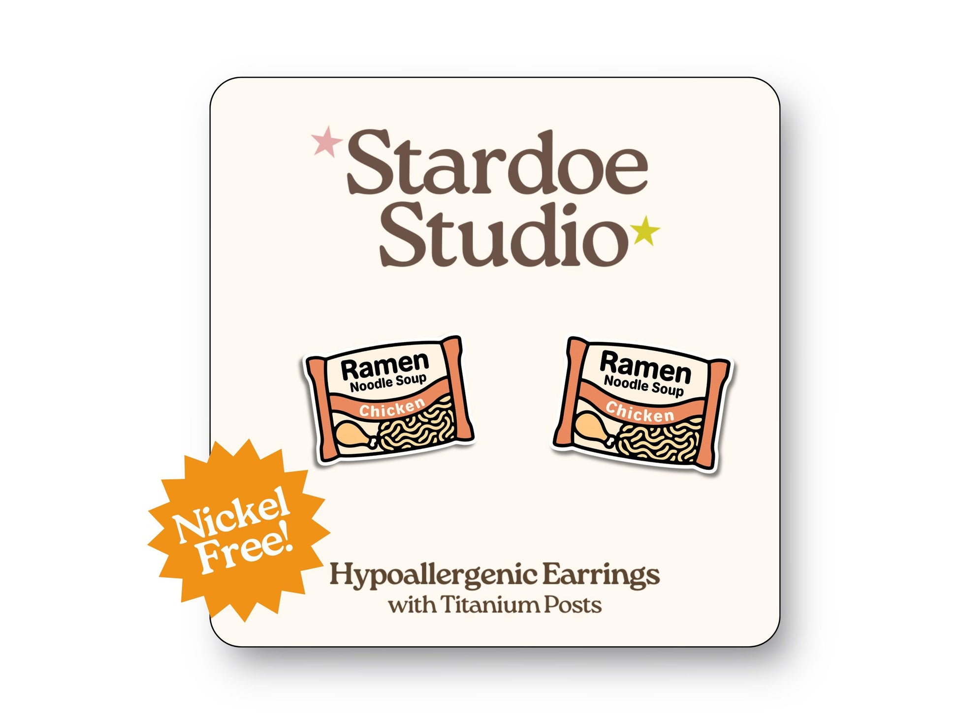 Cute instant ramen noodle stud earrings featuring a black bowl with yellow noodles and toppings playful food jewelry for kids and adults