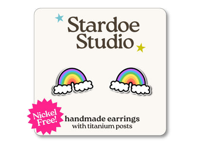 Little rainbow stud earrings featuring a colorful arc design. These earrings are handmade with hypoallergenic titanium posts fun jewelry for kids and adults.