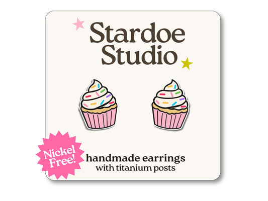 Little pink cupcake stud earrings featuring a cute frosted cupcake design. These earrings are hypoallergenic titanium posts dessert jewelry for kids and adults