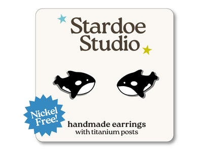 Little orca whale stud earrings featuring a cute black and white orca design. These earrings are hypoallergenic titanium posts cute animal jewelry for kids and adults.
