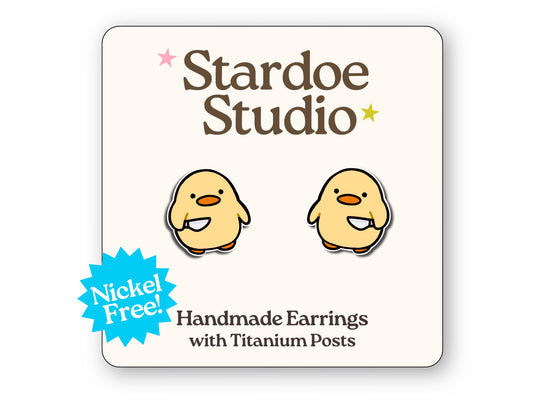 Little duck with knife stud earrings featuring a quirky and mischievous duck design. These earrings are hypoallergenic titanium posts funny animal jewelry for kids and adults.
