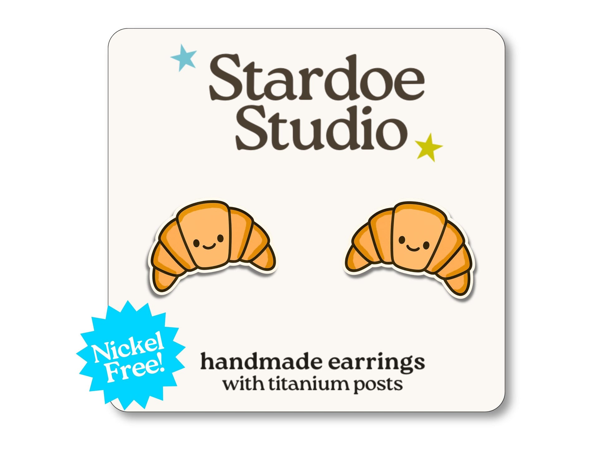 Little croissant stud earrings featuring a golden pastry design. These earrings are handmade with hypoallergenic titanium posts food jewelry for kids and adults.