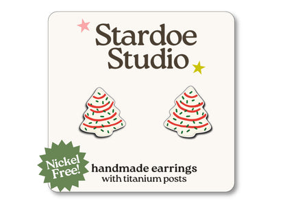 Little Christmas tree cookie stud earrings featuring a colorful tree cookie design. These earrings are hypoallergenic titanium posts fun holiday jewelry for kids and adults.